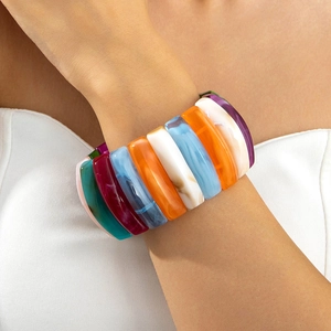 Detailed close-up of a wide acrylic stretch bracelet with colorful resin marble blocks
