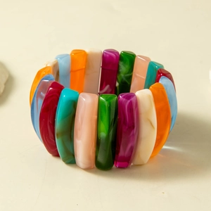 Detail of colorful acrylic chunky bracelet with marble patterns and elastic stretch band