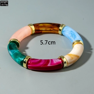 Detail of colorful resin bracelet showing 5.7cm diameter and segments with gold links