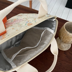 Sac à déjeuner matelassé fleuri avec isolation thermique et poche filet interne