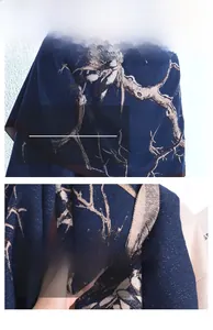 Detailed view of dark blue vintage branch print scarf showing soft knit fabric texture