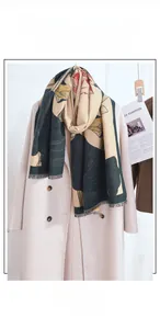 Detailed texture of cashmere-like pashmina scarf with lotus prints and fringe edge