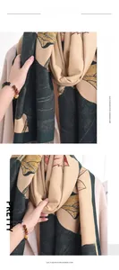 Detailed macro view of soft imitation cashmere scarf with leaf patterns and fringe edges