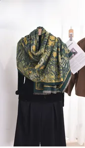 Detail of vintage oil painting style cashmere scarf with elegant fringe and moss green patterns