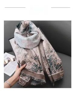 Detail view of vintage cashmere-like scarf with floral print and tassel edges in dark green