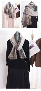 Artistic landscape print cashmere scarf featuring soft beige and green tones with fringe