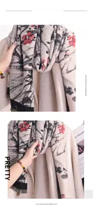 Detail of floral plum blossom print on soft imitation cashmere scarf with tassels