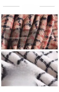 Macro detail of soft plaid cashmere fabric showing fine texture and weaving patterns