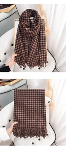 Detailed view of coffee plaid cashmere scarf featuring thick fringe and soft knit texture