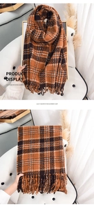 Detail of caramel plaid imitation cashmere scarf featuring elegant fringe tassels