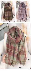 Detailed close-up of premium plaid tassels on soft winter cashmere-feel scarves