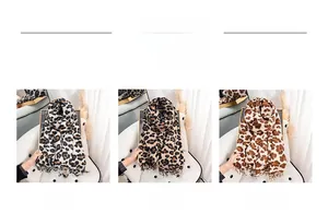 Detail display of leopard print scarves in Black White, Khaki, and Rice Camel with tassels