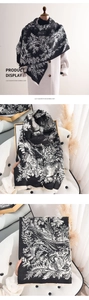 Detail showing high-quality black and white floral pattern on soft imitation cashmere scarf