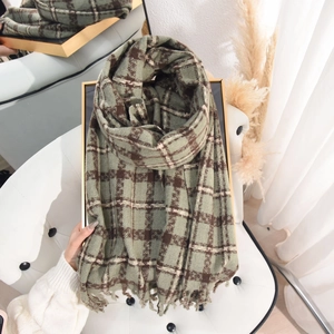 Green and brown plaid scarf with soft fringe edges for winter warmth