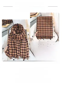 Detail view of houndstooth scarf showing brown fringe edges and soft cashmere texture