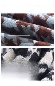 Macro view of knit cashmere-like fabric showing classic houndstooth patterns in two colors