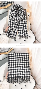 Detail of soft imitation cashmere scarf featuring black and white houndstooth pattern and tassels