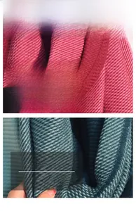 Macro shot of bicolor knitted cashmere scarf showing soft thick vertical rib texture