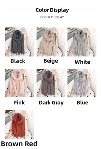 Detail display of soft cashmere-like scarves in seven colors with elegant fringe trim