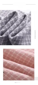 Detailed texture of lilac plaid imitation cashmere scarf with soft thick fringe detail