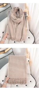 Close-up of light brown and white plaid cashmere scarf with soft fringed edges detail