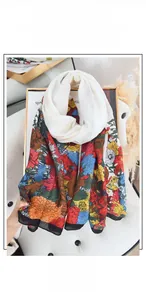 Detail of vintage floral print scarf with multi-color patterns on an elegant sofa