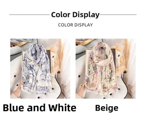 Detail of floral printed scarves in blue-white and beige on a stylish leather chair