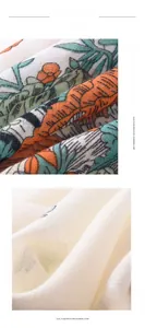Detail of soft imitation cashmere scarf showing orange green floral prints and white fabric