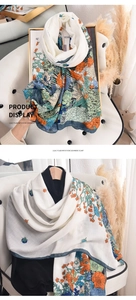 Detail showing the floral pattern and soft texture of a long imitation cashmere scarf