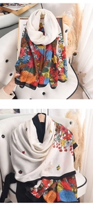 Close-up of floral print cotton-linen scarf with vintage flower patterns and black borders