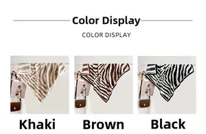 Detail view of khaki brown and black zebra print silk scarves draped with premium texture