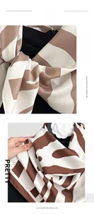 Detailed view of striped imitation cashmere scarf with elegant wavy pattern texture