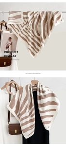 Detail view of British style zebra print silk scarf with luxury smooth texture and pattern