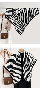 Detail view of British style zebra print square scarf with classic black and white stripes