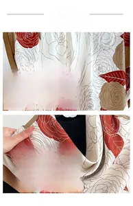 Detail of floral printed silk scarf showing fine stitching and soft chiffon texture