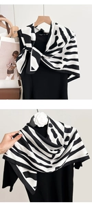 Close-up of zebra pattern satin scarf with elegant black and white animal print design