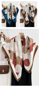 Detail of camellia floral print on a square silk scarf with fine rolled edges