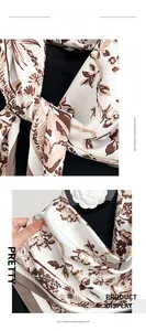 Macro detail of imitation cashmere scarf showing elegant floral print and soft fabric texture