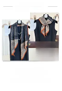 Detail view of ethnic paisley printed long scarf with lightweight draped fabric