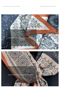 Detail of geometric rhombus pattern and floral lace print on soft silk scarf
