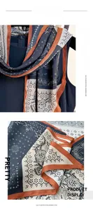 Close-up of ethnic paisley pattern and soft texture on long imitation cashmere scarf