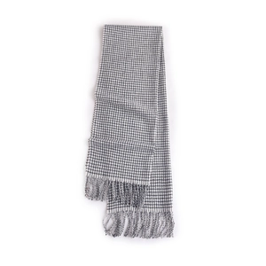 Classic black and white plaid cashmere-like scarf with elegant fringe trim on white background