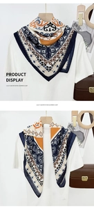Detail of vintage bohemian print square scarf in navy and orange imitation cashmere