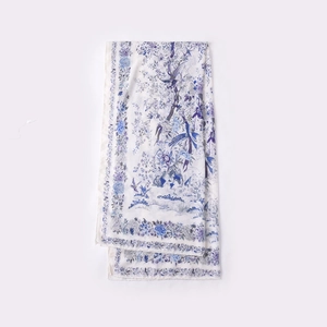 Elegant floral print scarf with blue flowers on white lightweight silk fabric