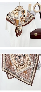 Detail view of vintage baroque pattern silk scarf with elegant floral border design