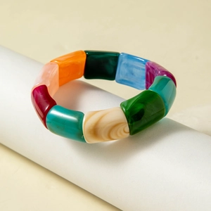 Detailed macro of colorful acrylic elastic bracelet beads with smooth glossy finish