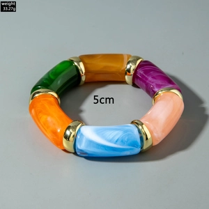 Detail view of colorful acrylic beaded bracelet with gold metal links and 5cm inner diameter