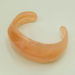 Retro acrylic open cuff bracelet in peach pink with a minimalist bohemian geometric design