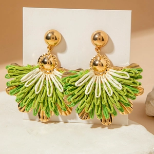 Bohemian raffia fan earrings in green and white with gold accents on white card