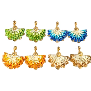 Set of four pairs of bohemian raffia fan earrings in various colorful gradient tassels
